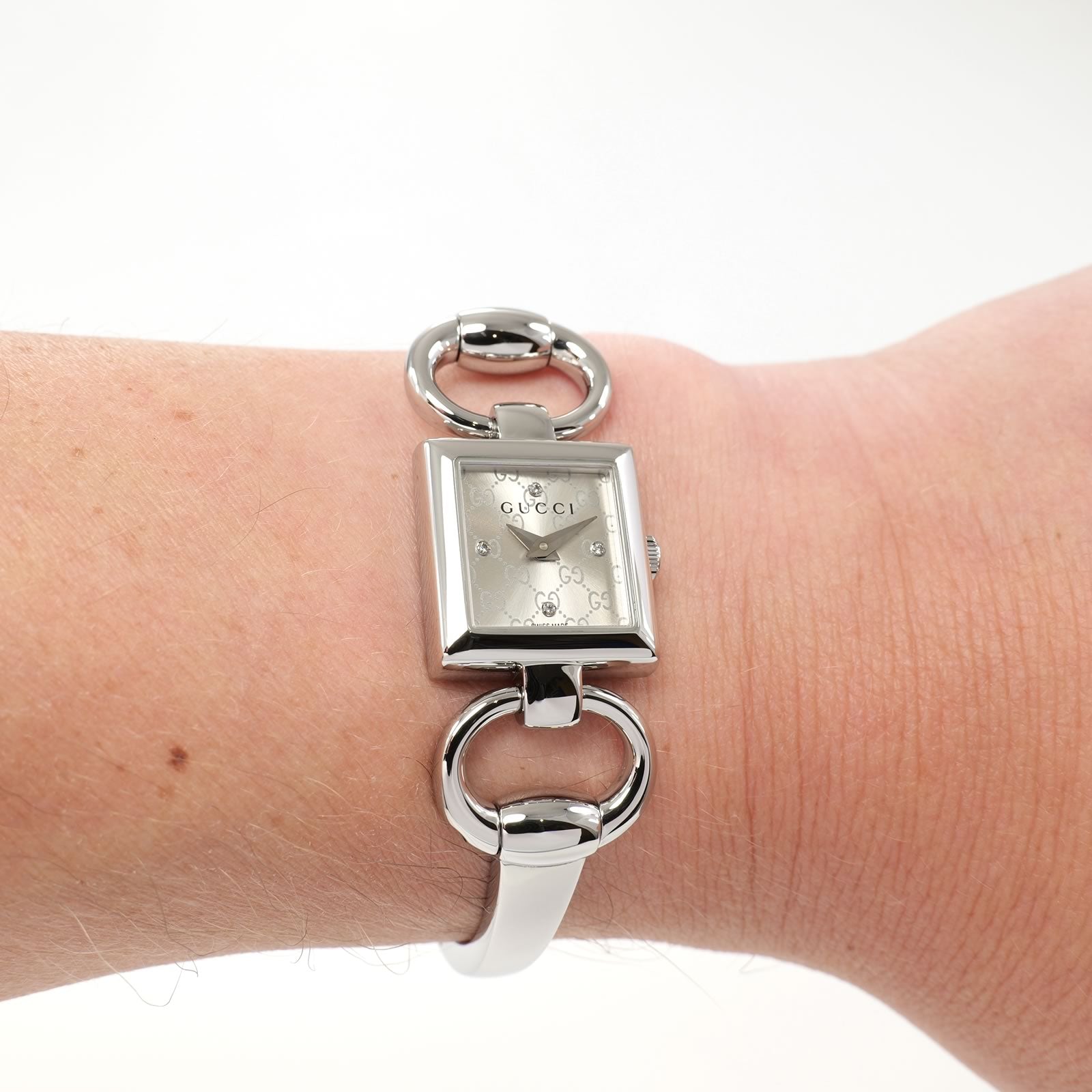 Gucci Tornabuoni 120 Ladies  Silver Sunburst Dial with 4 Diamonds on the wrist