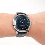 Omega De Ville Trésor 435.13.40.21.03.001 Men's blue dial watch on the wrist