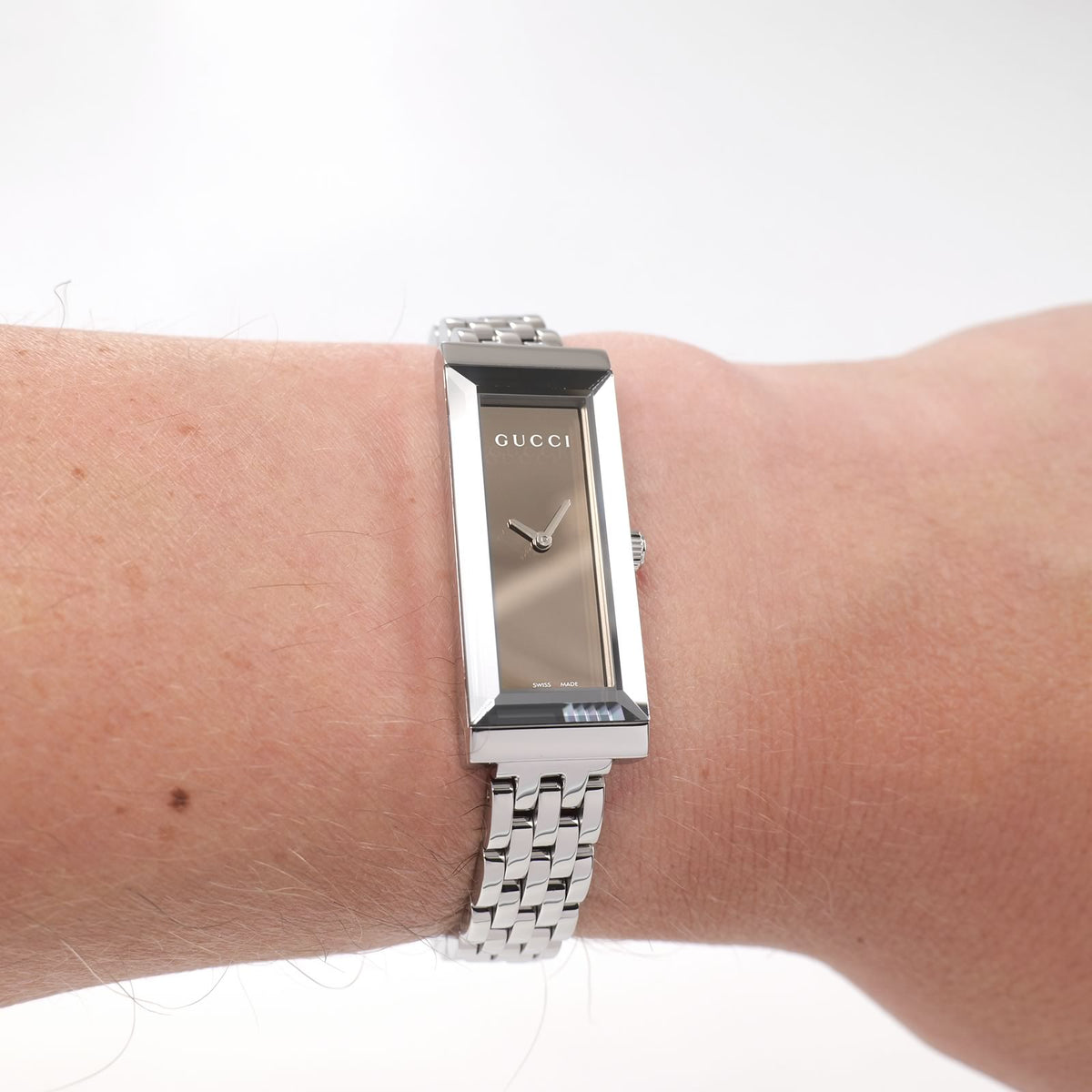 Gucci G-Frame YA127501 Ladies Mirror Dial Rectangular watch on the wrist