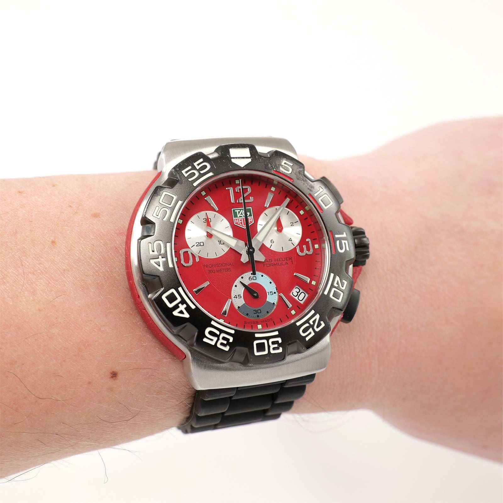 TAG Heuer Formula 1 CAC1112 Red Chronograph watch on the wrist