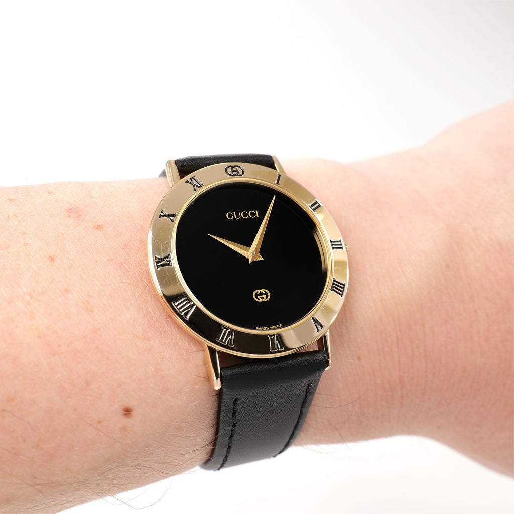Gucci 3000M Black Dial 18k Gold Plated watch on the wrist