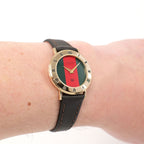 Gucci 3000L Red and Green Dial ladies 18k gold plated watch on the wrist