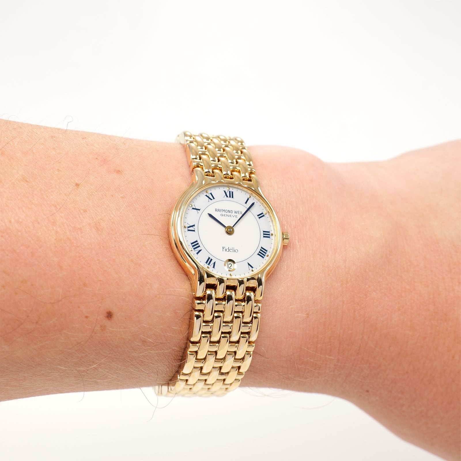 Raymond Weil Fidélio 4702 Ladies White & Blue Dial Roman Numeral watch on the wrist