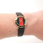 Gucci 3000L Ladies Red & Green Dial 18k Gold watch on the wrist