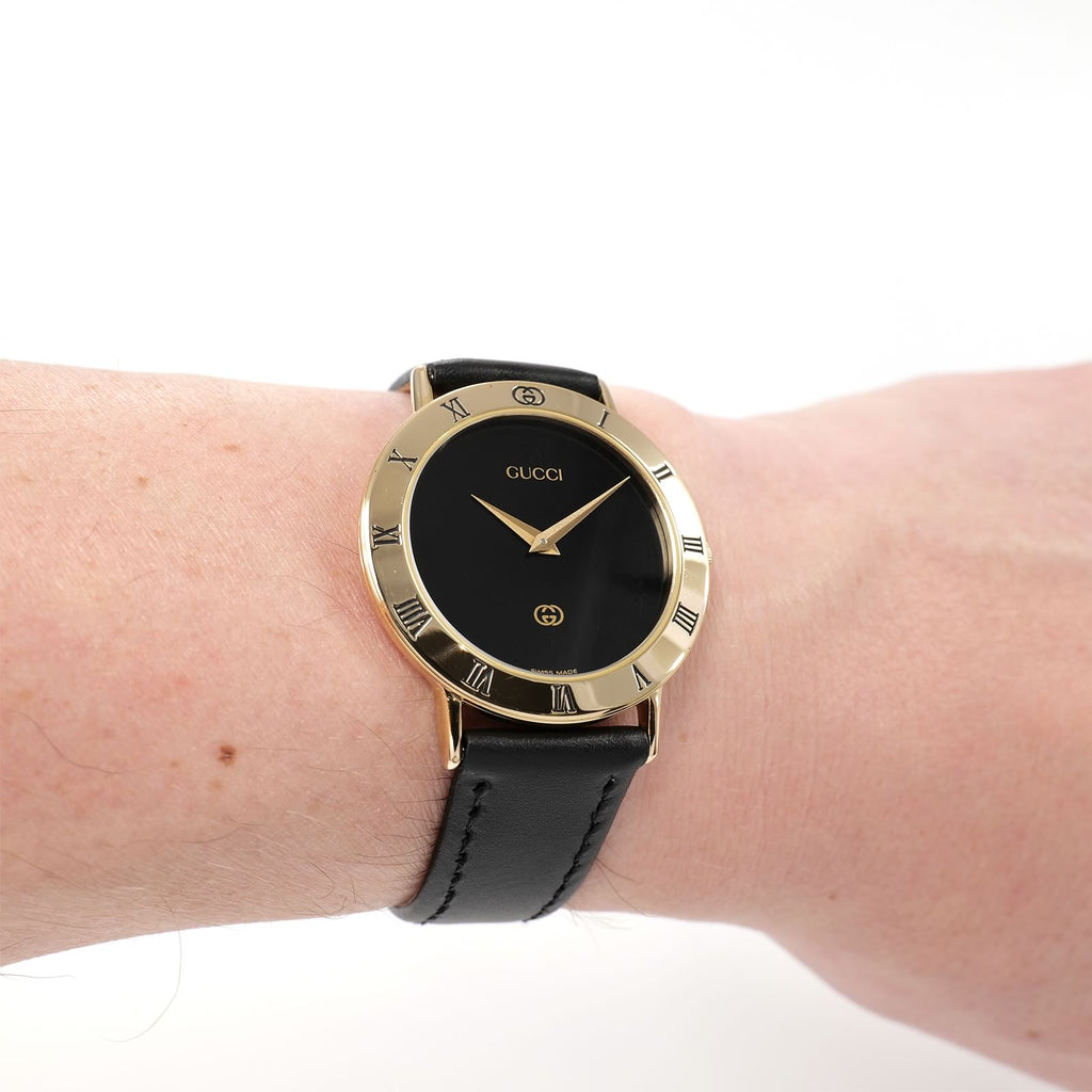 Gucci 3000M Black Dial 18k Gold Plated watch on the wrist