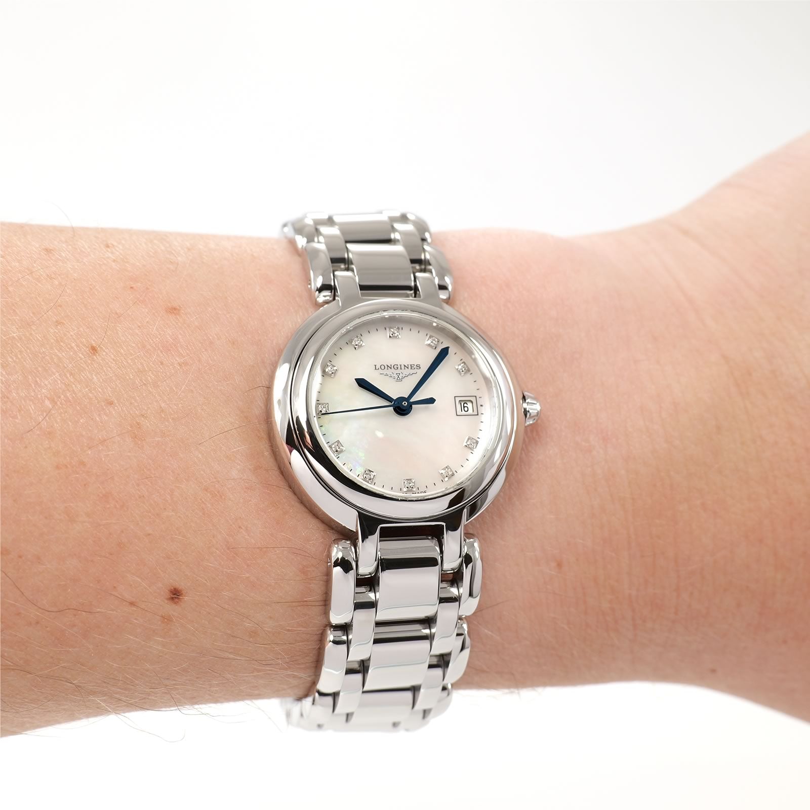 Longines PrimaLuna L8.110.4 Ladies White Mother of Pearl dial watch on the wrist