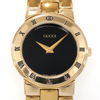 Gucci 3300L Black Dial 18k Gold Plated Roman Numeral bezel close up