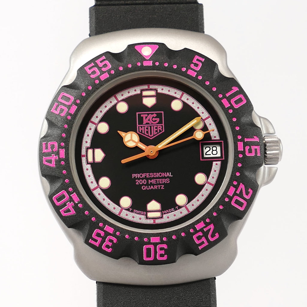 TAG Heuer Formula 1 377.513 dial close up pink orange hands
