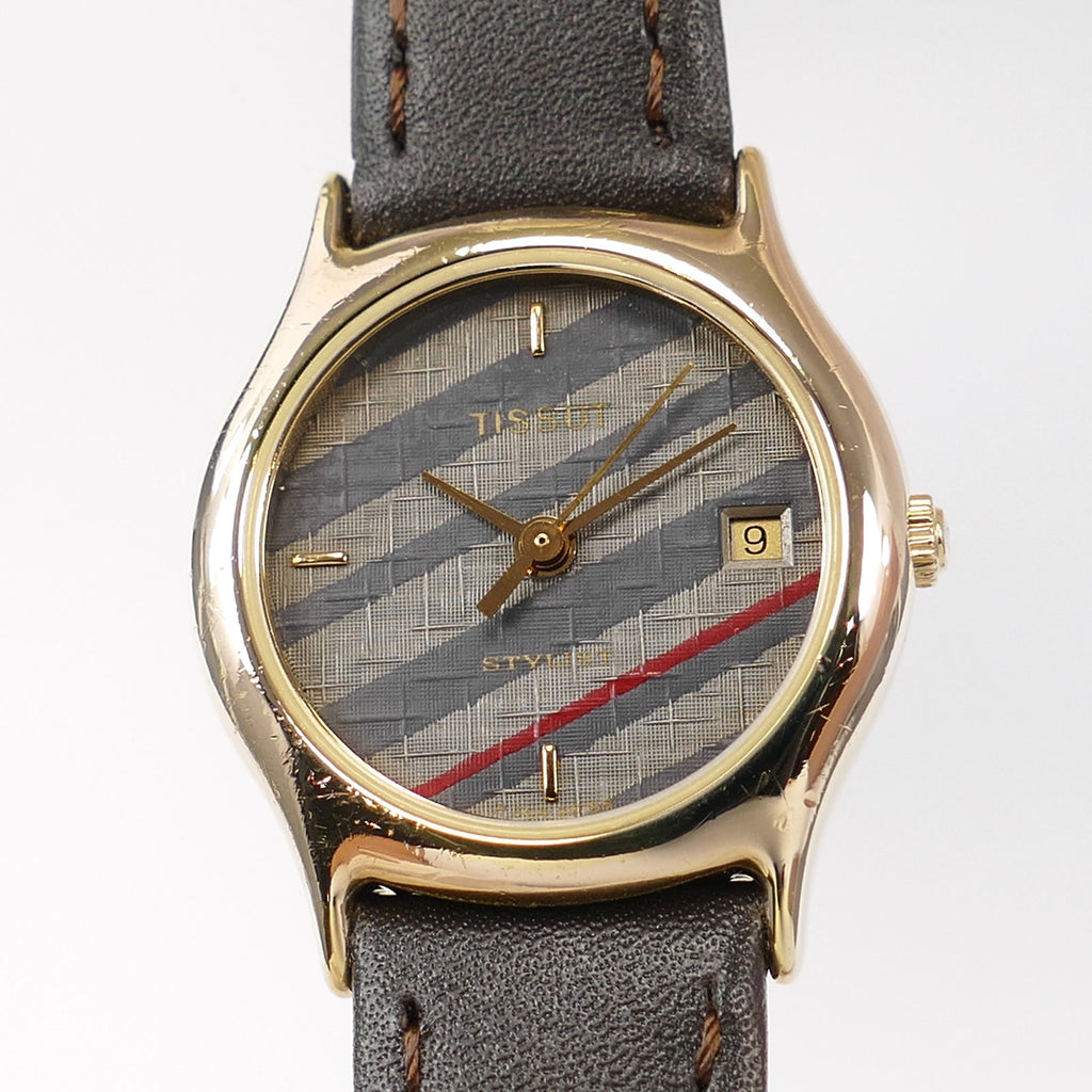 Tissot Stylist F304 Grey / Blue Woven Dial close up