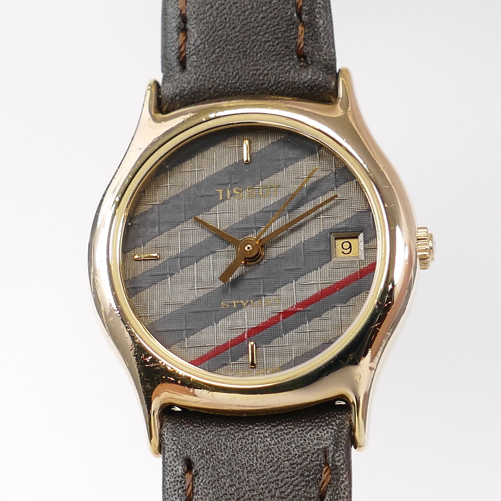 Tissot Stylist F304 Grey / Blue Woven Dial close up