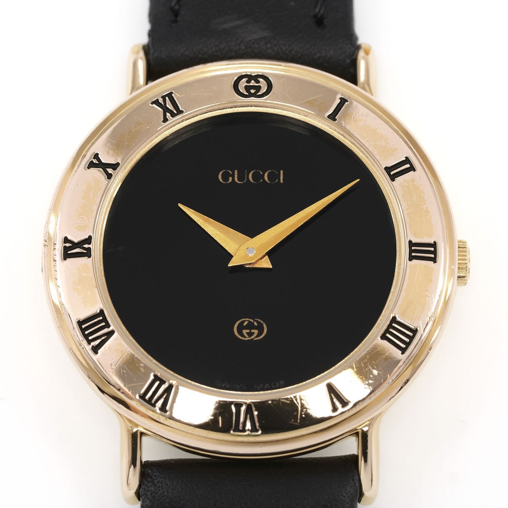 Gucci 3000L Black Dial 18k Gold Plated Roman Numeral bezel close up