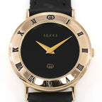 Gucci 3000L Black Dial 18k Gold Plated Roman Numeral bezel close up