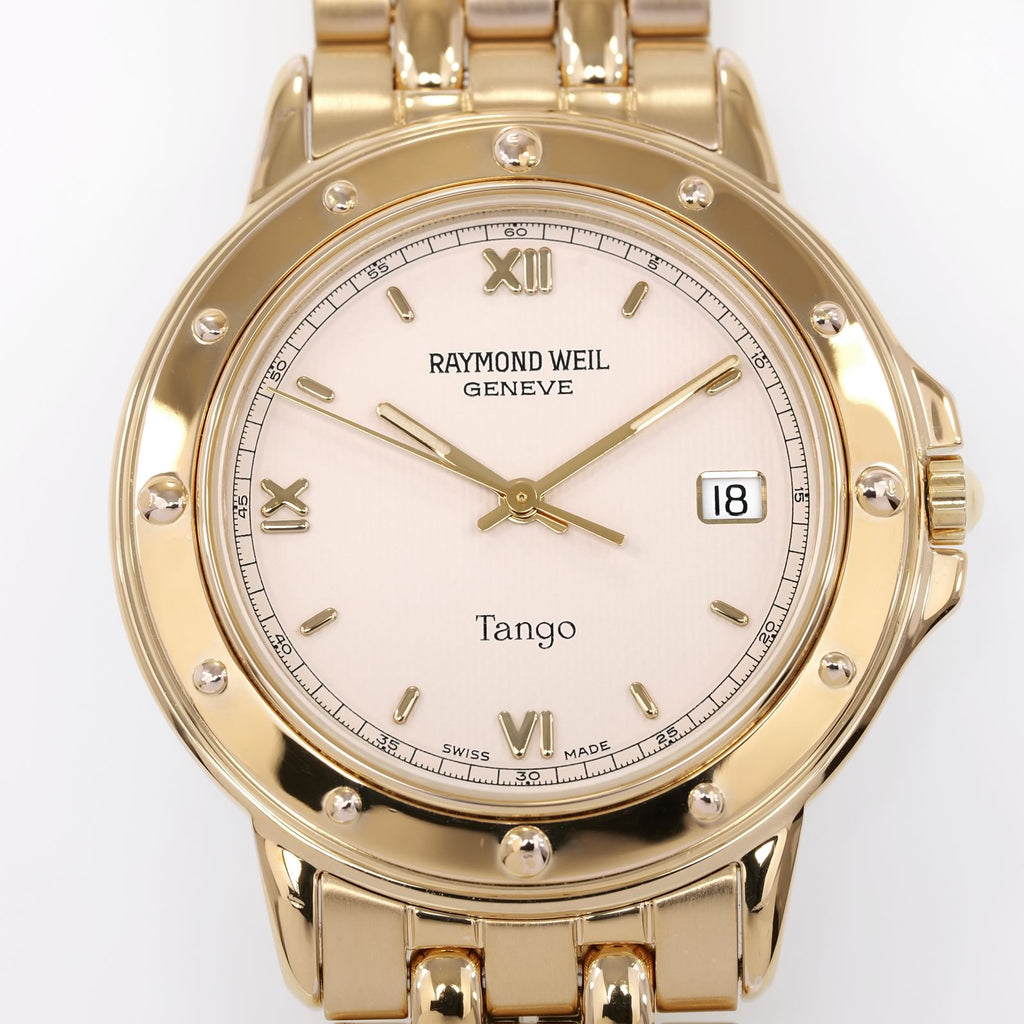 Raymond Weil Tango 5560 Cream Guilloche quarter Roman Numeral Dial close up