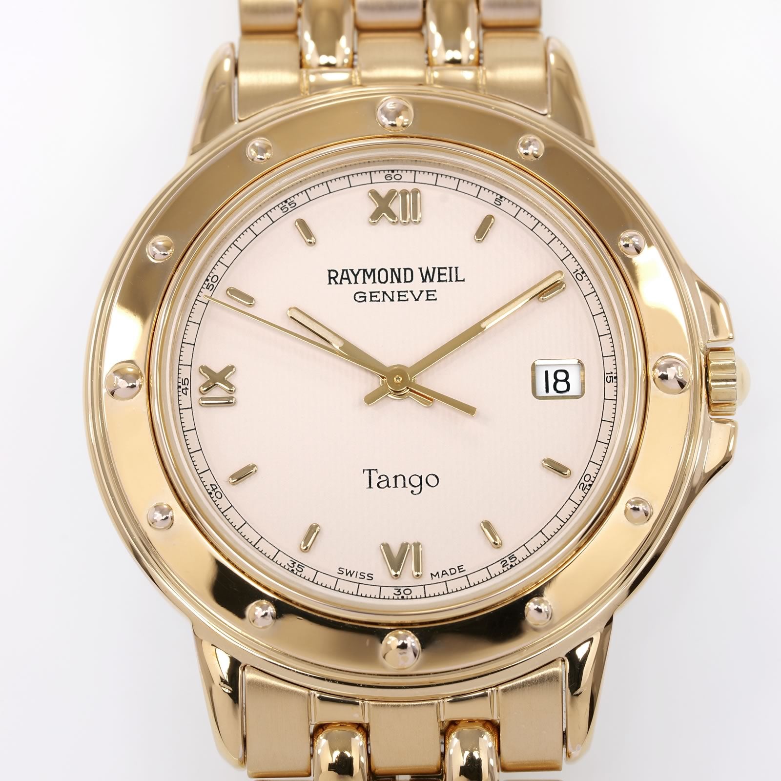 Raymond Weil Tango 5560 Cream Guilloche quarter Roman Numeral Dial close up