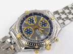 Breitling Chronomat B13050.1 gold accents with date and tachymeter