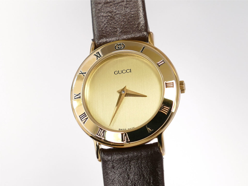 Gucci 3000L Champagne Dial Roman Numeral bezel