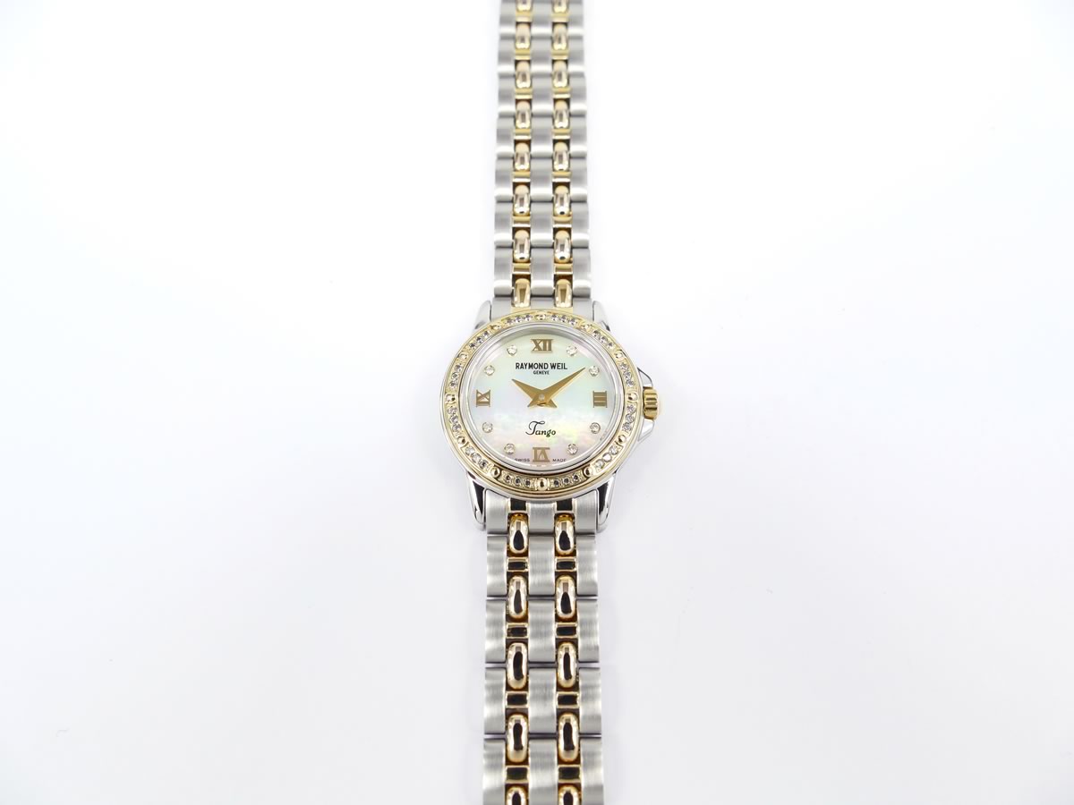 Raymond Weil Tango 5860 gold bezel set with genuine diamonds